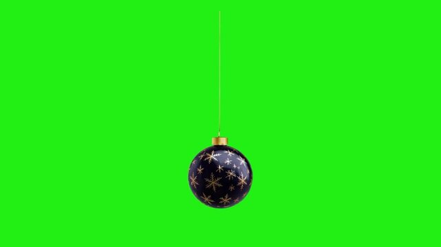 Animated black Christmas ornament with gold snowflakes hanging on a green screen background. Perfect for Chrismast,  new year, celebraton, etc
