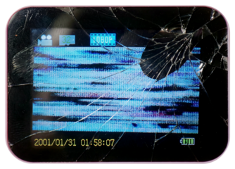 Close-up of a broken digital camera or handheld device screen displaying distorted static, glitch artifacts and a cracked glass surface.