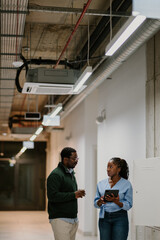 Coworkers discussing business strategies during office break