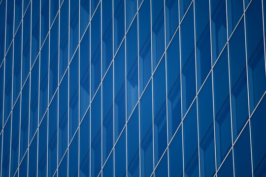 Cityscape with scenic view of a modern steel and glass skyscraper facade at the urban neighborhood of Skyline Hills in San Diego, California.
