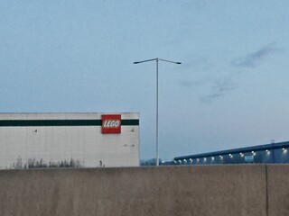 Fototapeta premium Prague,Czech Republic-May 6 2025: Exterior of LEGO Group’s large modern distribution center near Prague, key logistics hub for Central and Eastern Europe.