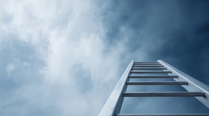 Fototapeta premium tall extension ladder pointing upward, concept of climbing to success, bright blue sky with clouds