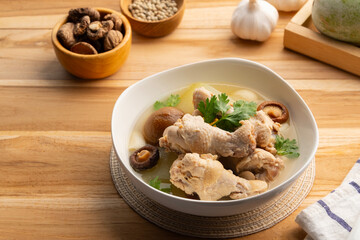 Winter Melon with Chicken wings (drumettes) and preserved lime soup in white bowl.Thai food.