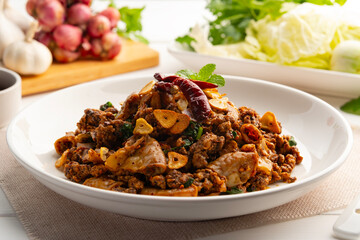 Stir fried minced pork salad,Spicy Northern Thai-Style food,fry mixed Ground pork with Pork Large Intestine and pig spleen in chilli paste.(larb moo)