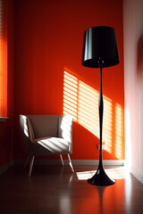 A dramatic interior scene featuring a modern black floor lamp and a light gray armchair set against a vibrant orange wall with strong sunlight streaming through blinds