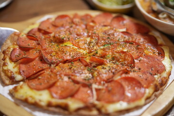 Delicious pepperoni pizza with melted cheese and crispy edges – close-up