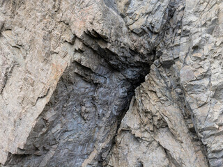 Rugged Cliff Face With Jagged Granite Rocks In A Natural Quarry Scene