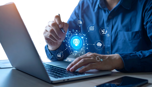 Person using a laptop with digital AI overlay, fingers near a digital brain graphic