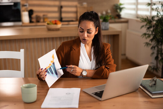 Professional Woman Presenting Business Chart