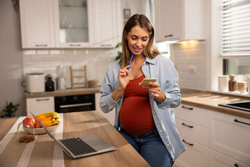 Pregnant Woman Listening To Online Classes