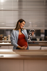 Pregnant Woman Holding Ultrasound