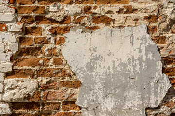Brick old, destroyed red wall, background with texture of old red brick wall and plaster elements
