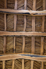 Handcrafted ceiling with palm tree beams
