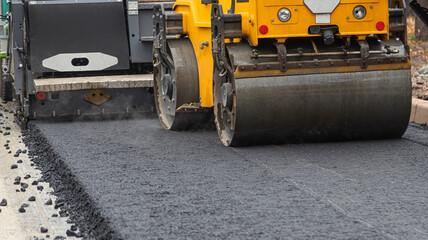 Laying Fresh Asphalt with Road Equipment