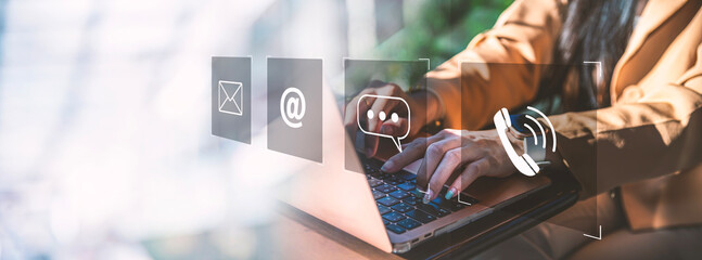 Digital Customer Communication & Support Interface, A modern business communication, Person typing on a laptop with floating digital icons representing email, messaging, phone, online contact methods.