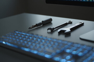 Computer repair desk with keyboard illuminated with wrench and screwdriver for it support and computer technician service