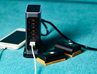 Battery charger. Multi-battery charger with multiple USB ports