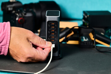 Battery charger. Multi-battery charger with multiple USB ports