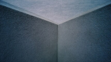 Close-up of smooth gray sealant applied at the junction of contrasting surfaces for precise finishing.