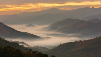 At dawn, the mountain landscape shrouded in mist shines with golden light on the panoramic foothills. Travel magazine, destination brand, designed specifically for outdoor magazines and nature guides.