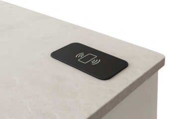 Black wireless charging pad on a surface, isolated on transparent background