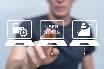 Person using virtual touch screen presses the words USER STATS. User statistic business analysis concept. User interface options, user statistics and high tech projects development.