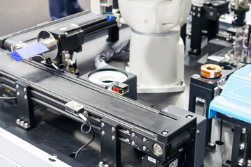 Robotic arms in large industrial production systems and robotic management systems