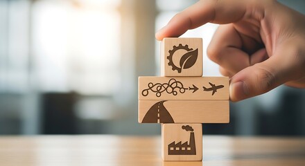 Hand arranging wooden blocks with icons representing industry, road, complexity, flight, and sustainability, symbolizing business process