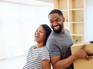 Fototapeta premium Young black couple moving into a new modern house, carrying boxes and arriving home together. Happy, excited and smiling husband and wife walking, entering and relocating after buying an apartment