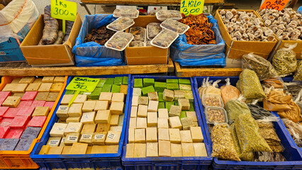 Colorful Turkish street market selling natural handmade soap, dried fruits and herbs. Authentic oriental shopping atmosphere