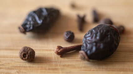 Wild Rose Hips on Wooden Surface
