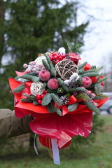 Christmas Bouquet with Fir Branches and Red Decorations