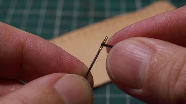 Threading a needle &mdash; close-up. Video