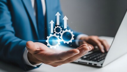 Businessman holding glowing gear icon with upward arrow graph