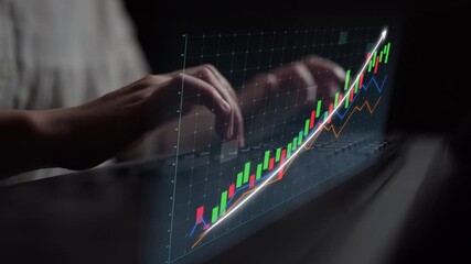 A close-up view of hands on a laptop keyboard interacting with a colorful digital analytics graph, showcasing financial growth trends and business performance insights. Copula - Powered by Adobe