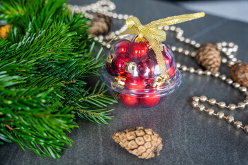 Close-up of a handmade Christmas wreath before decoration, surrounded by various festive ornaments...