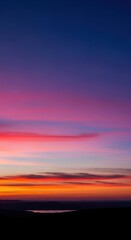 Obraz premium Serene panoramic view captured during the last minutes of twilight, showcasing deep atmospheric color gradients across the vast horizon, wide, outdoor, sky