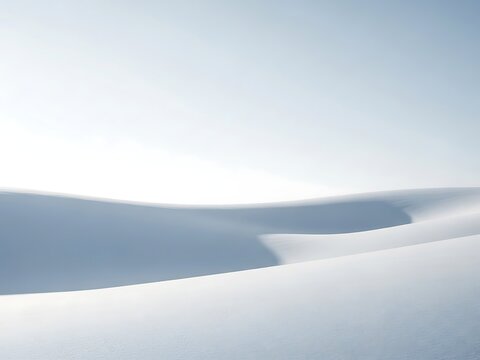 Minimalist abstract view of smooth white snow dune under bright sky