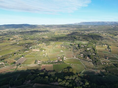 Aerial drone view of green fields and rural landscape in southern France