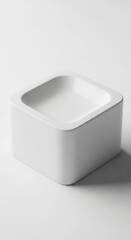 Minimalist white ceramic soap dish with rounded edges on a white background