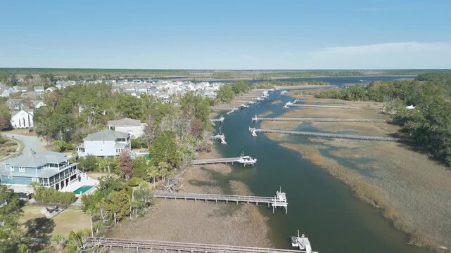 aerial view of marsh creek with docks and homes in charleston sc 