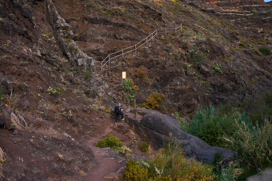 Hiker climbing Anaga mountain trail