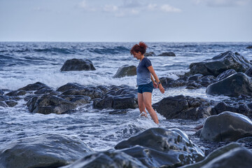 Playful wading at Playa Tamadiste