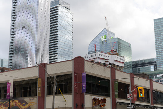 (bottom) The Ballroom Bowl (left) Thomson Reuters, condo, TD Terrace, and Forma under construction seen from John and Richmond, Toronto