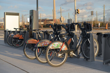 Fototapeta premium bike rental docking station with vehicles, Toronto