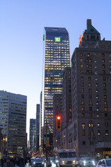 Fototapeta premium looking west on Front St W to Fairmont Royal York hotel and TD Terrace, dusk, Toronto