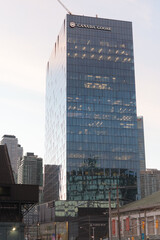 Fototapeta premium exterior building elevation and sign of Canada Goose corporate office located at 100 Queens Quay E, dusk, Toronto