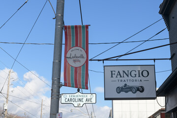 Fototapeta premium projecting banner at Leslieville and Fangio Trattoria at Caroline and 1111 Queen St E, Toronto