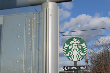 Obraz premium Starbucks Mermaid logo sign at 23 Leslie St, Toronto