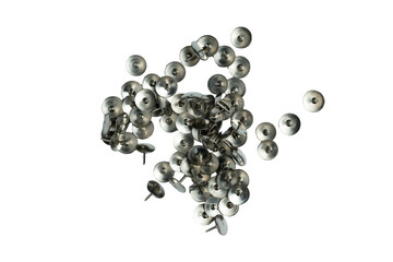 Scattered metal thumb tacks on transparent background

